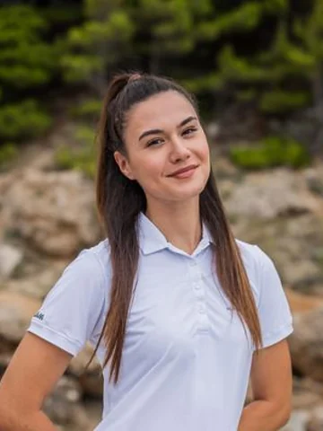 Josipa Bravić, stewardess on luxury yacht Karisma, in a white crew polo shirt
